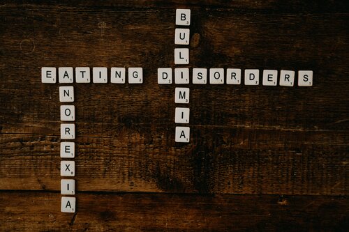 eating disorders spelt out in scrabble tiles