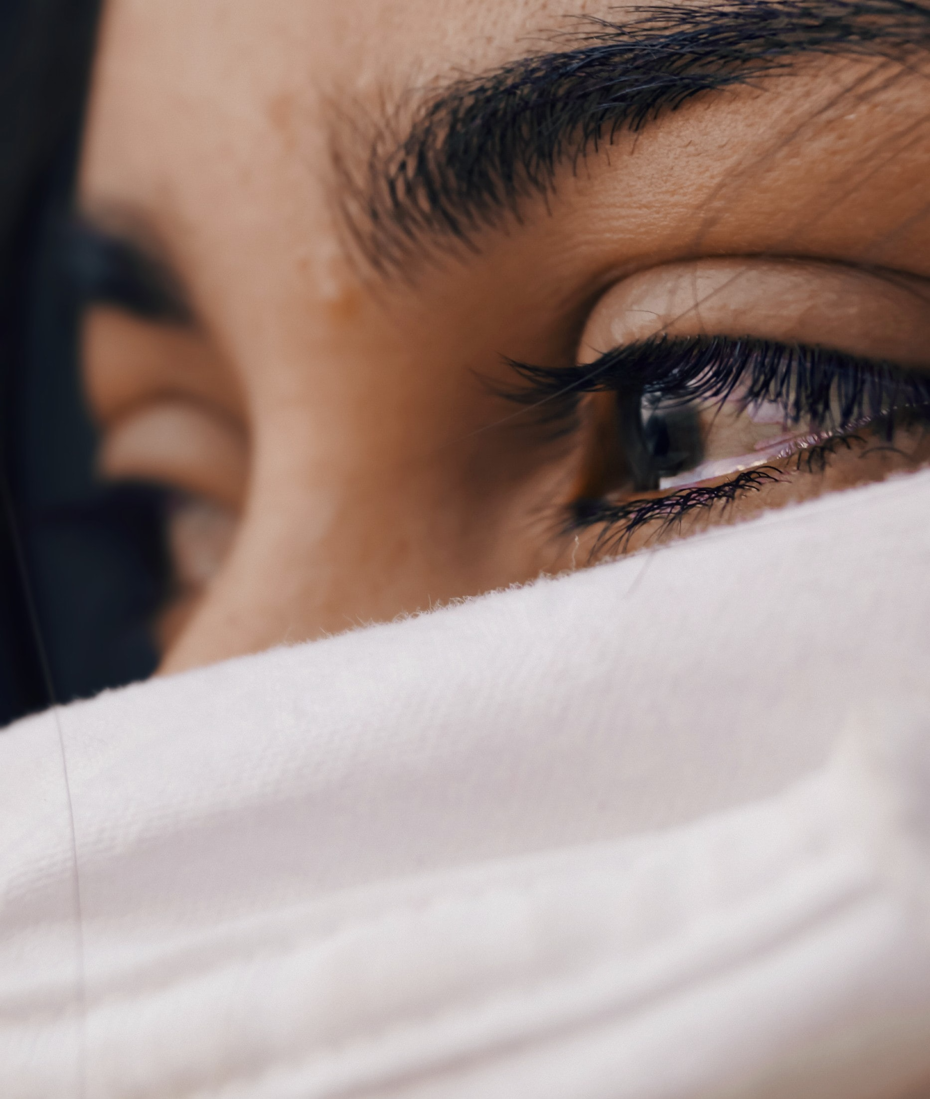 lady with tears in here eyes close up